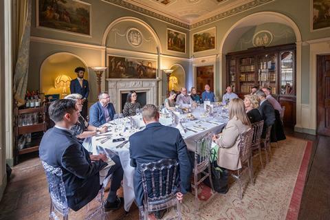 13 delegates join editor Katie Scott and deputy editor Yiannis Kotoulas around a large oval-shaped table to discuss the latest developments in insurance fraud. They sit in a low-lit room, surrounded by bookcases and paintings on the walls.